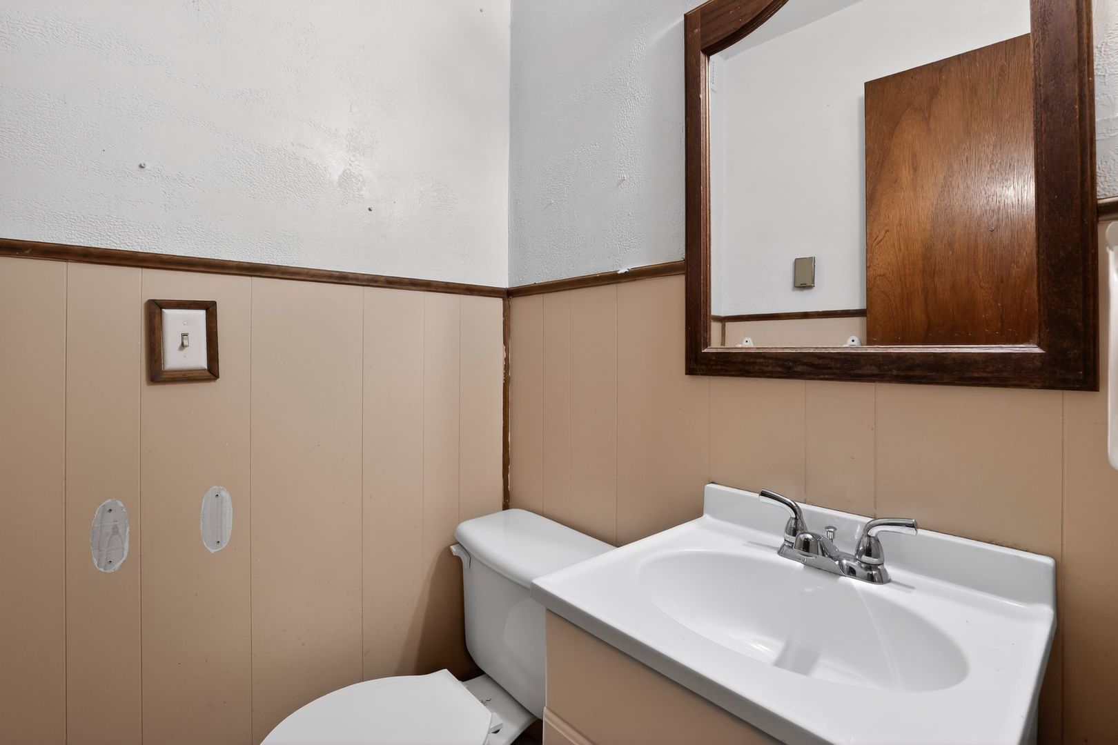 1531 North Charleston Road Salem, IL 62881 - Photo 27 of 34 a bathroom with a sink mirror and toilet