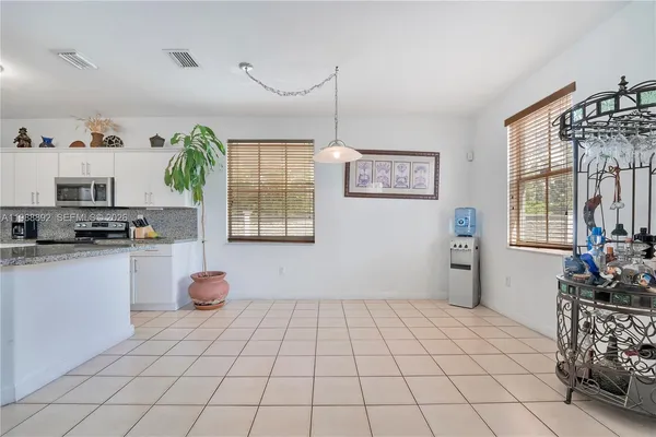 a view of kitchen with furniture and window