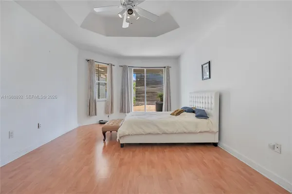 a bed room with two bed and a large window