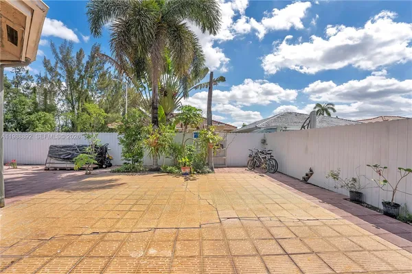a view of a backyard of the house