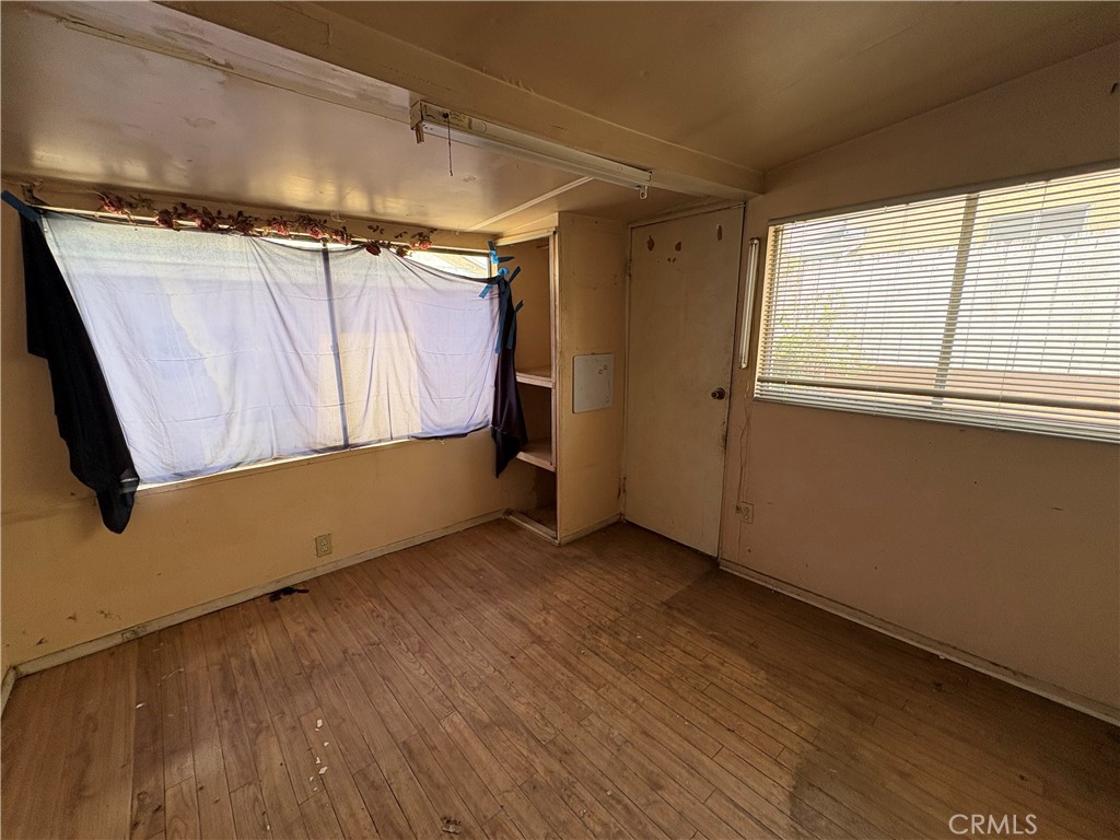 14023 Studebaker Road Norwalk, CA 90650 - Photo 19 of 33 a view of a garage with wooden floor