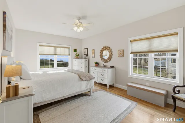 a bedroom with bed and window