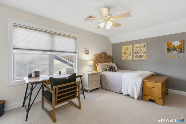 a bed room with a bed and a window