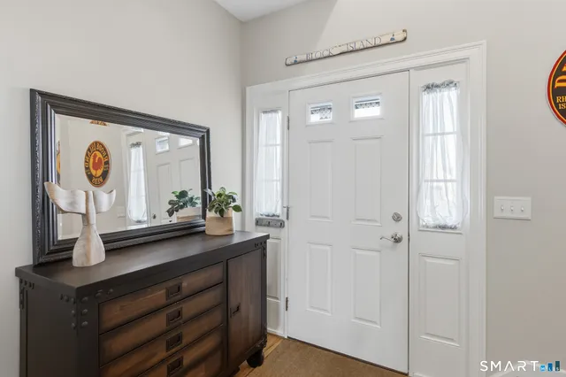 a bathroom with a sink a mirror and a window