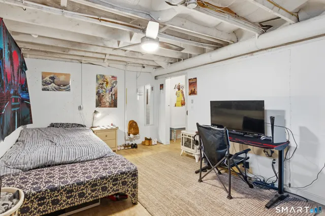 a bedroom with a bed and a chair