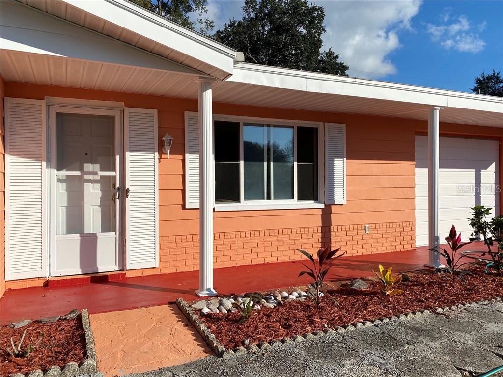 3612 Springfield Drive Holiday, FL 34691 - Photo 2 of 13 a view of a house with a backyard