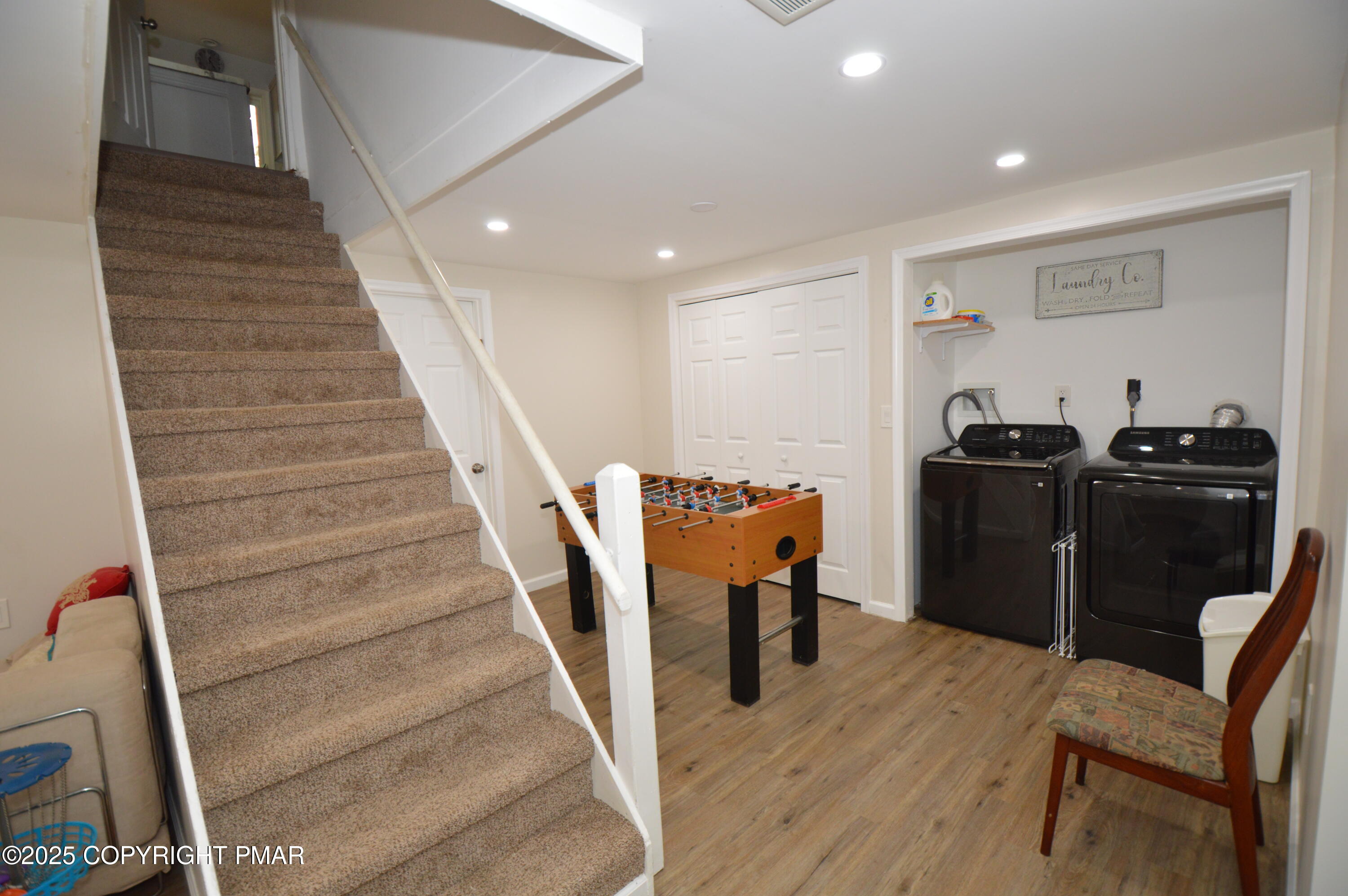 128 Ashley Court Bushkill, PA 18324 - Photo 35 of 43 a view of a hallway with wooden floor and stairs