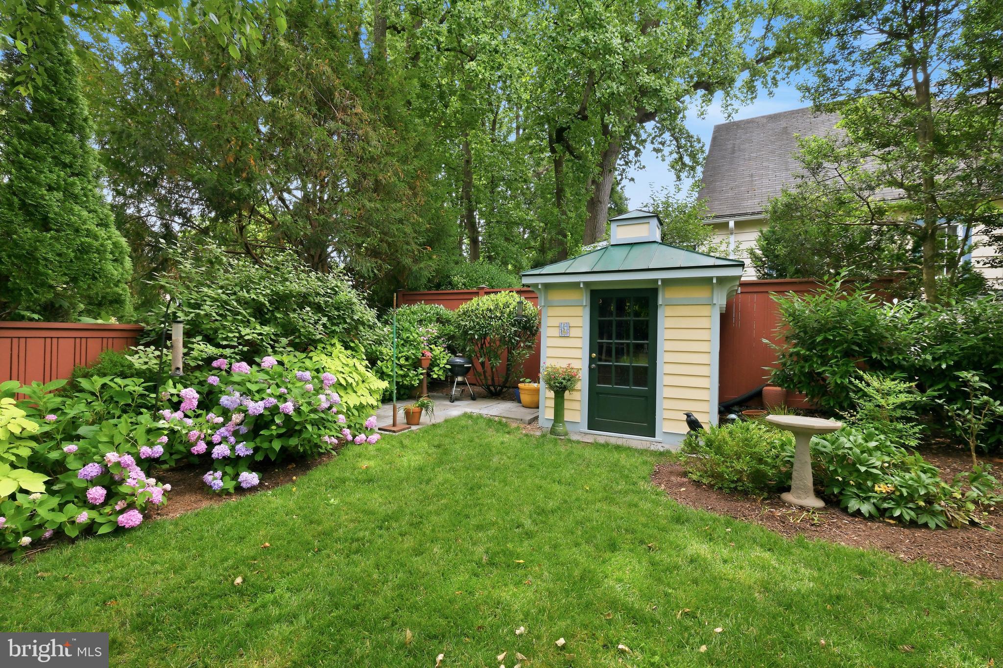 6411 33rd Street Northwest Washington, DC 20015 - Photo 41 of 48 a front view of a house with a garden