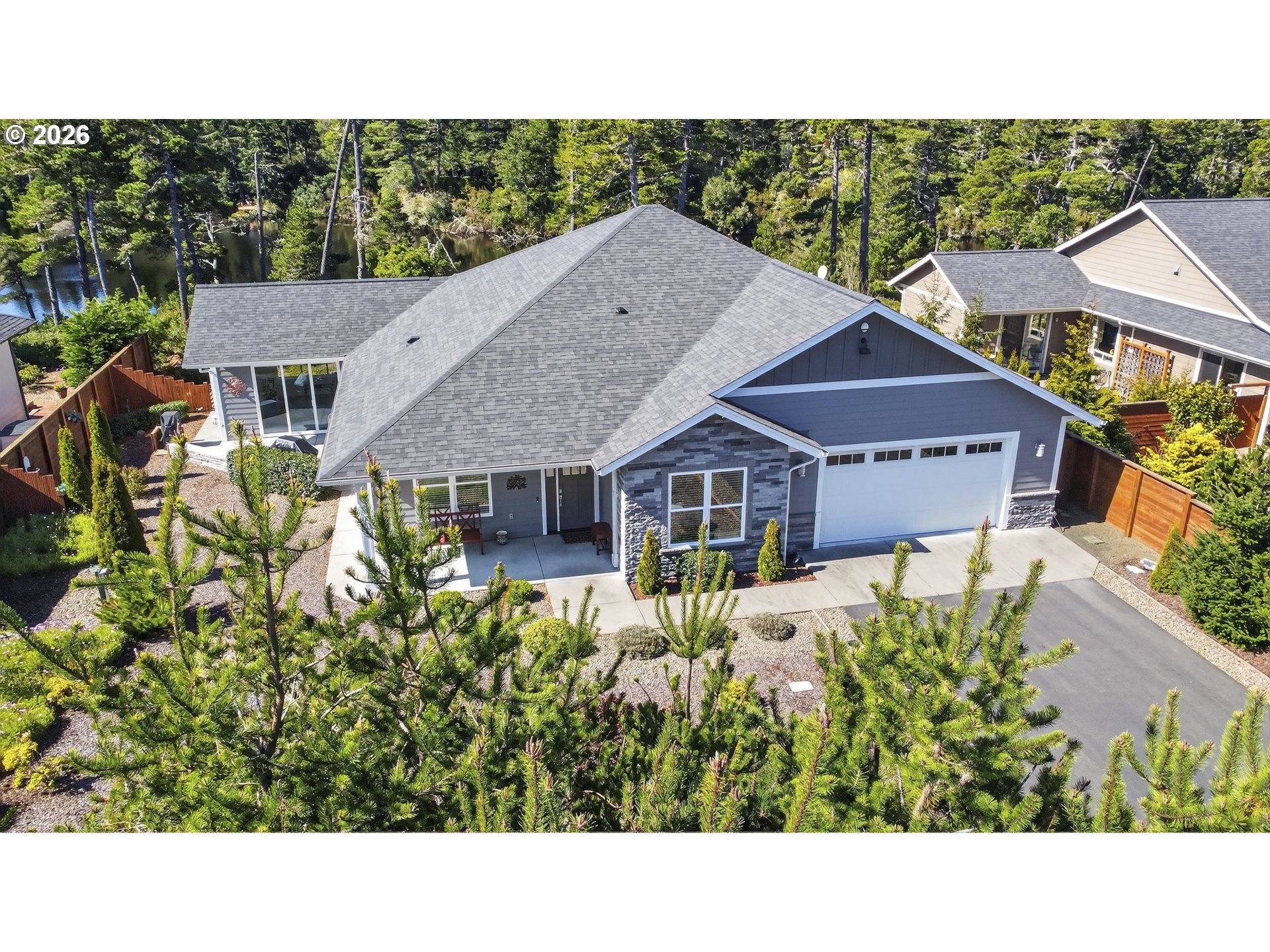 88084 Lake Point Drive Florence, OR 97439 - Photo 4 of 22 a aerial view of a house with a yard