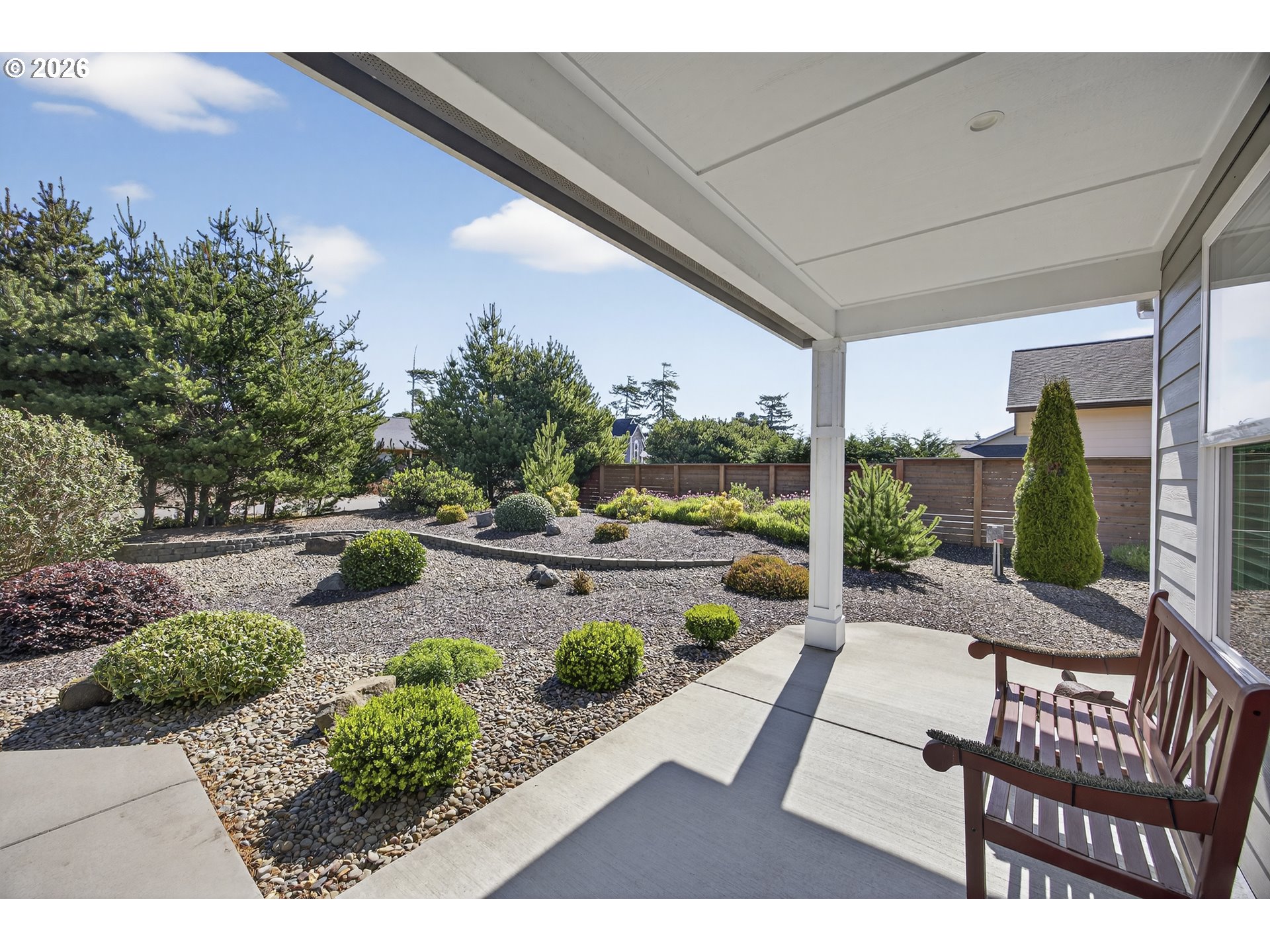 88084 Lake Point Drive Florence, OR 97439 - Photo 5 of 22 a view of a patio with couches table and chairs and potted plants