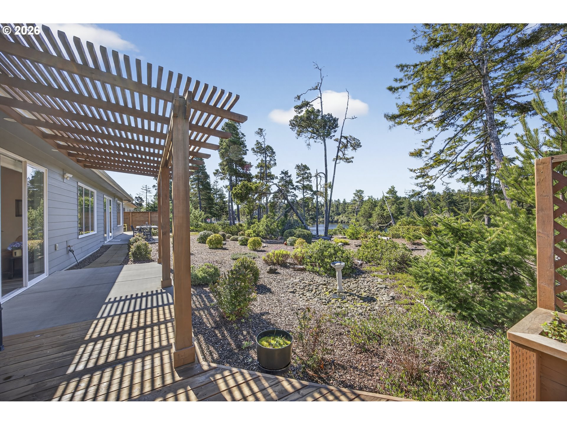 88084 Lake Point Drive Florence, OR 97439 - Photo 7 of 22 a view of a porch with a garden