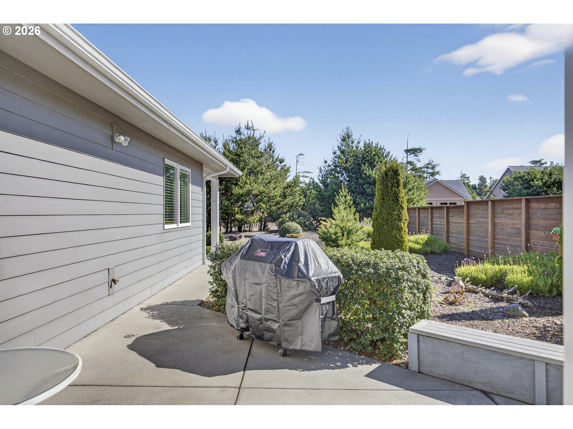 88084 Lake Point Drive Florence, OR 97439 - Photo 8 of 22 a view of a backyard with sitting area
