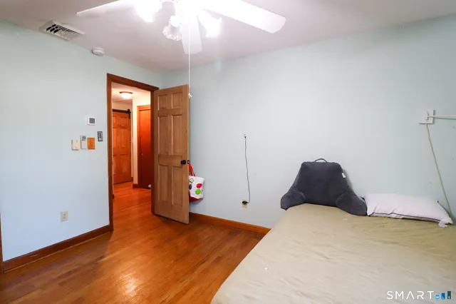 a view of a dining room with furniture and a chandelier