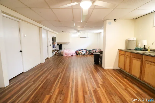 a room with wooden floor and natural light