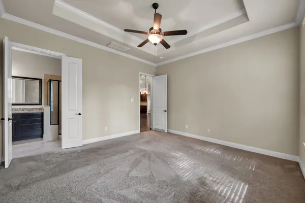 a view of a livingroom with a ceiling fan