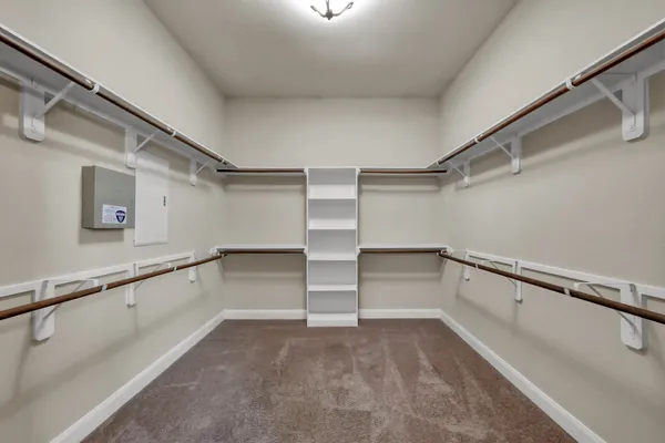 a view of an empty walk in closet