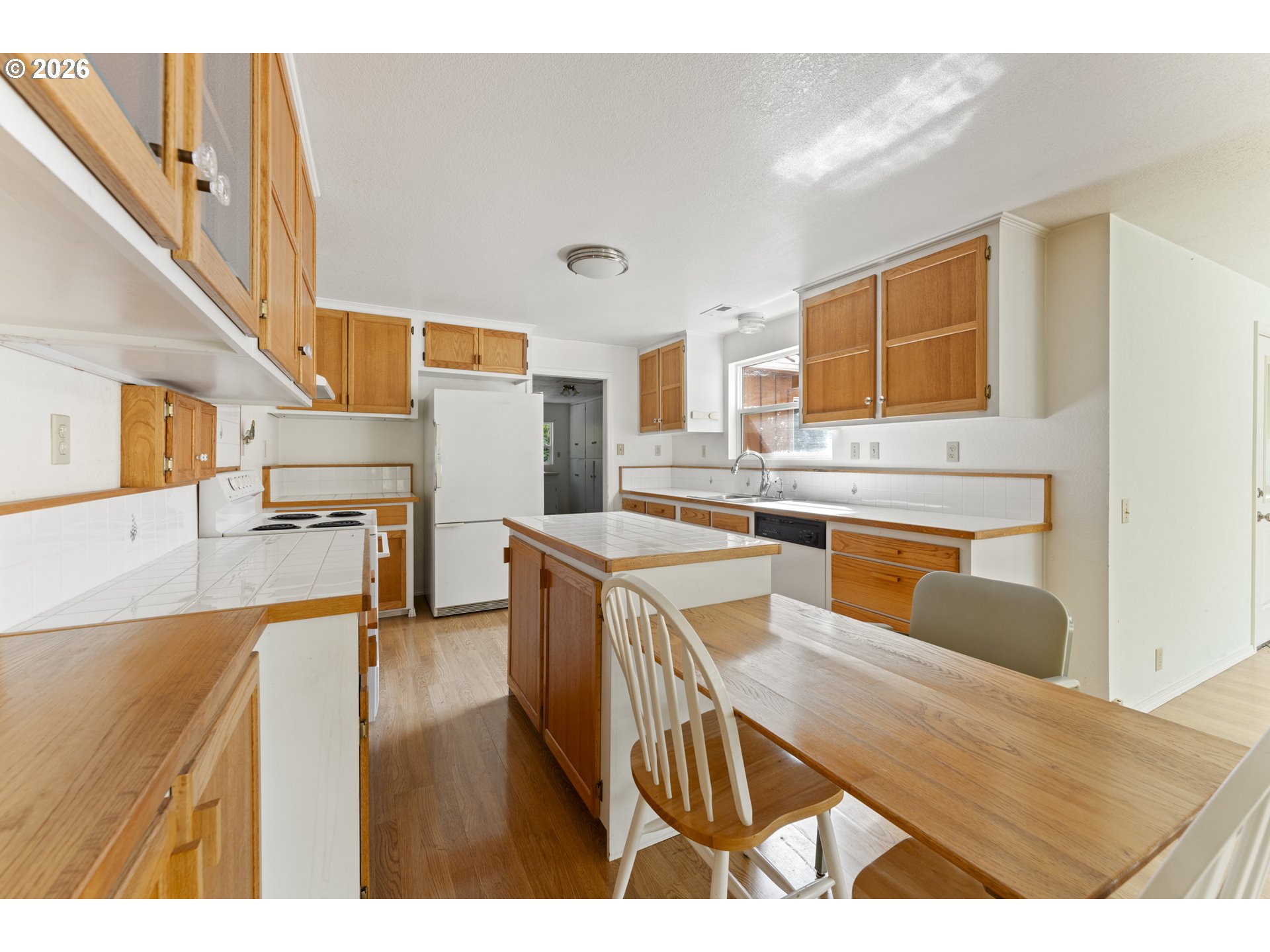 67085 Marlow Creek Road Coos Bay, OR 97420 - Photo 13 of 48 a kitchen with stainless steel appliances granite countertop a sink and a refrigerator