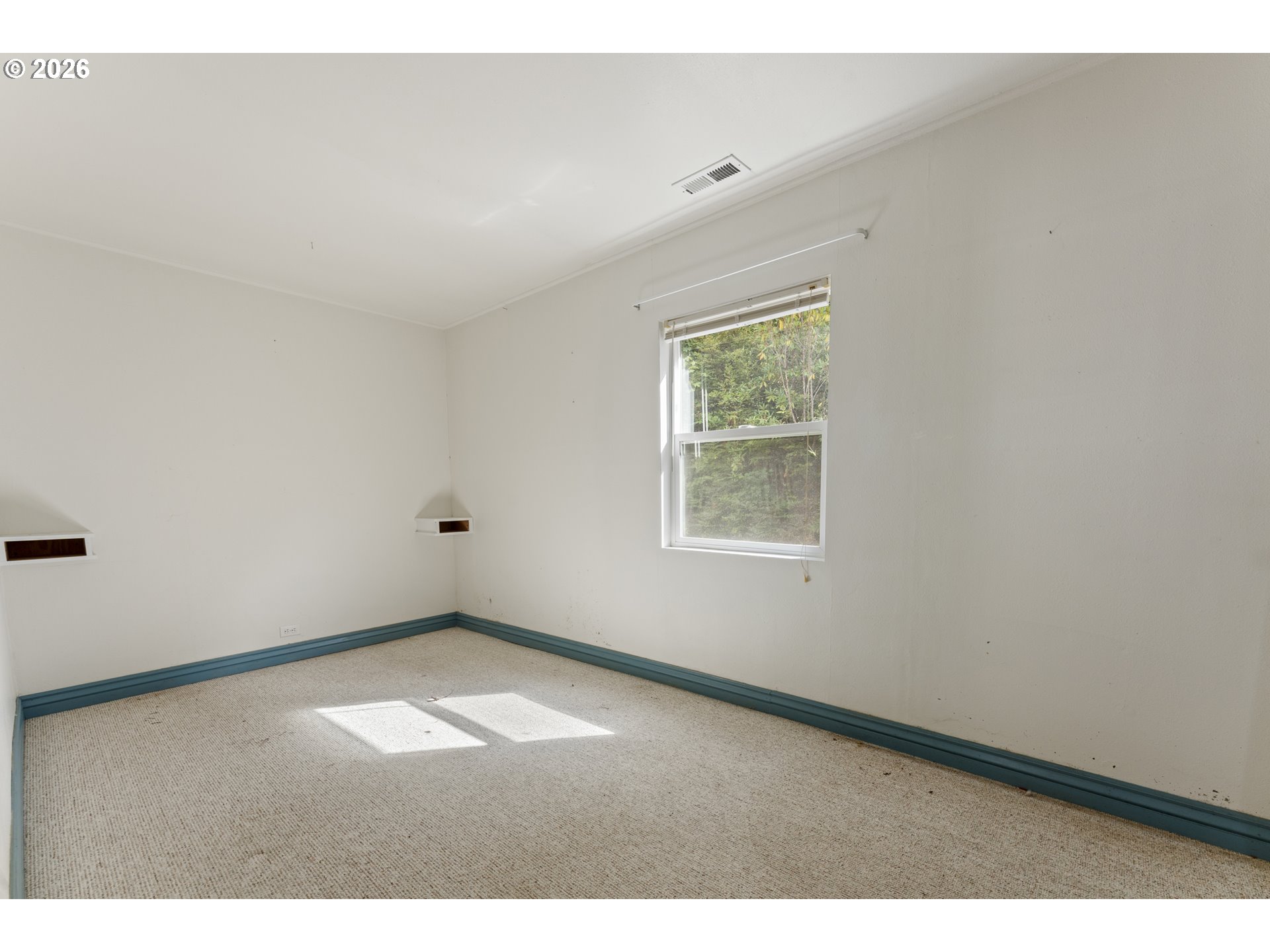 67085 Marlow Creek Road Coos Bay, OR 97420 - Photo 22 of 48 an empty room with windows