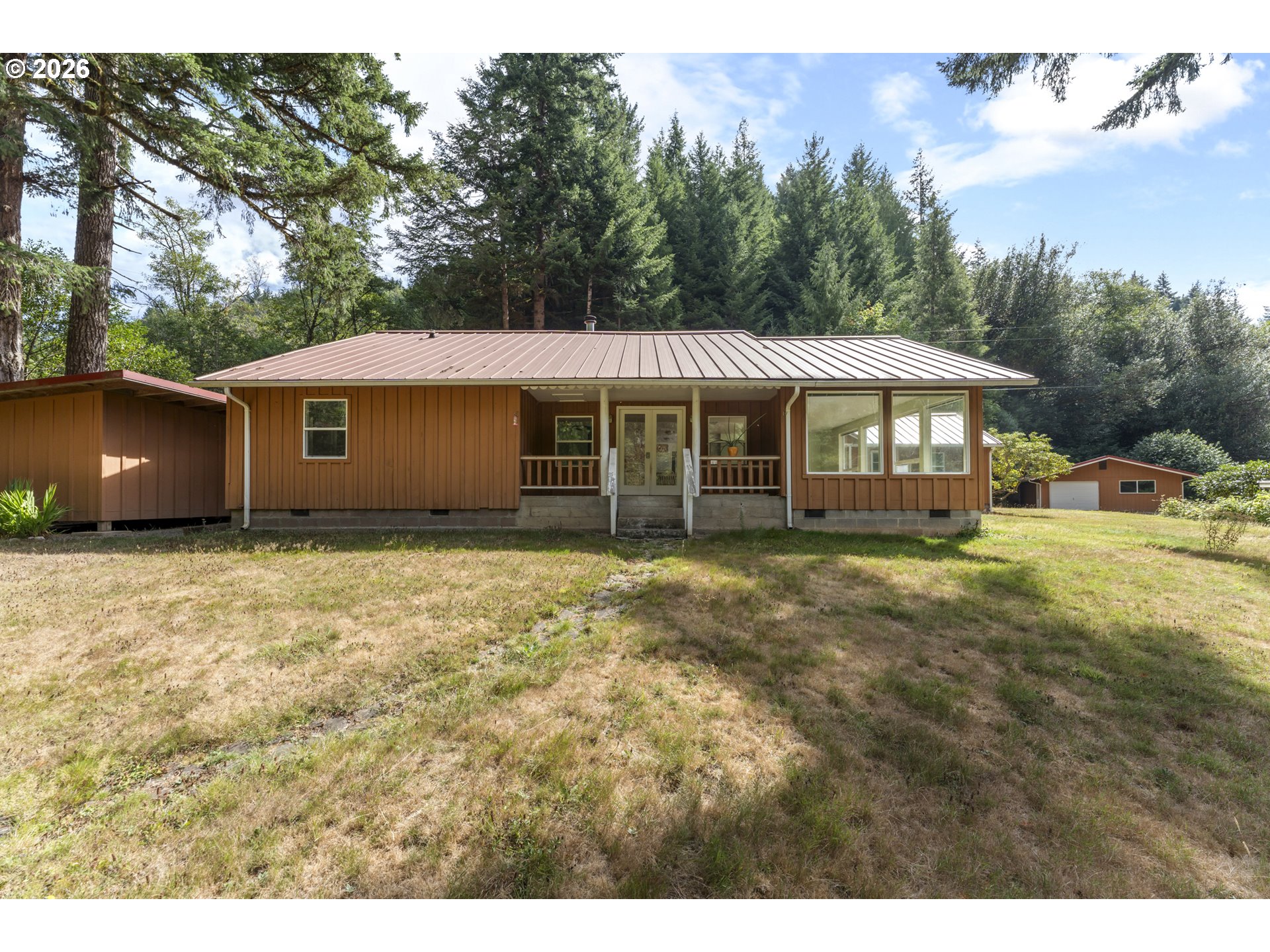 67085 Marlow Creek Road Coos Bay, OR 97420 - Photo 8 of 48 a front view of a house with garden