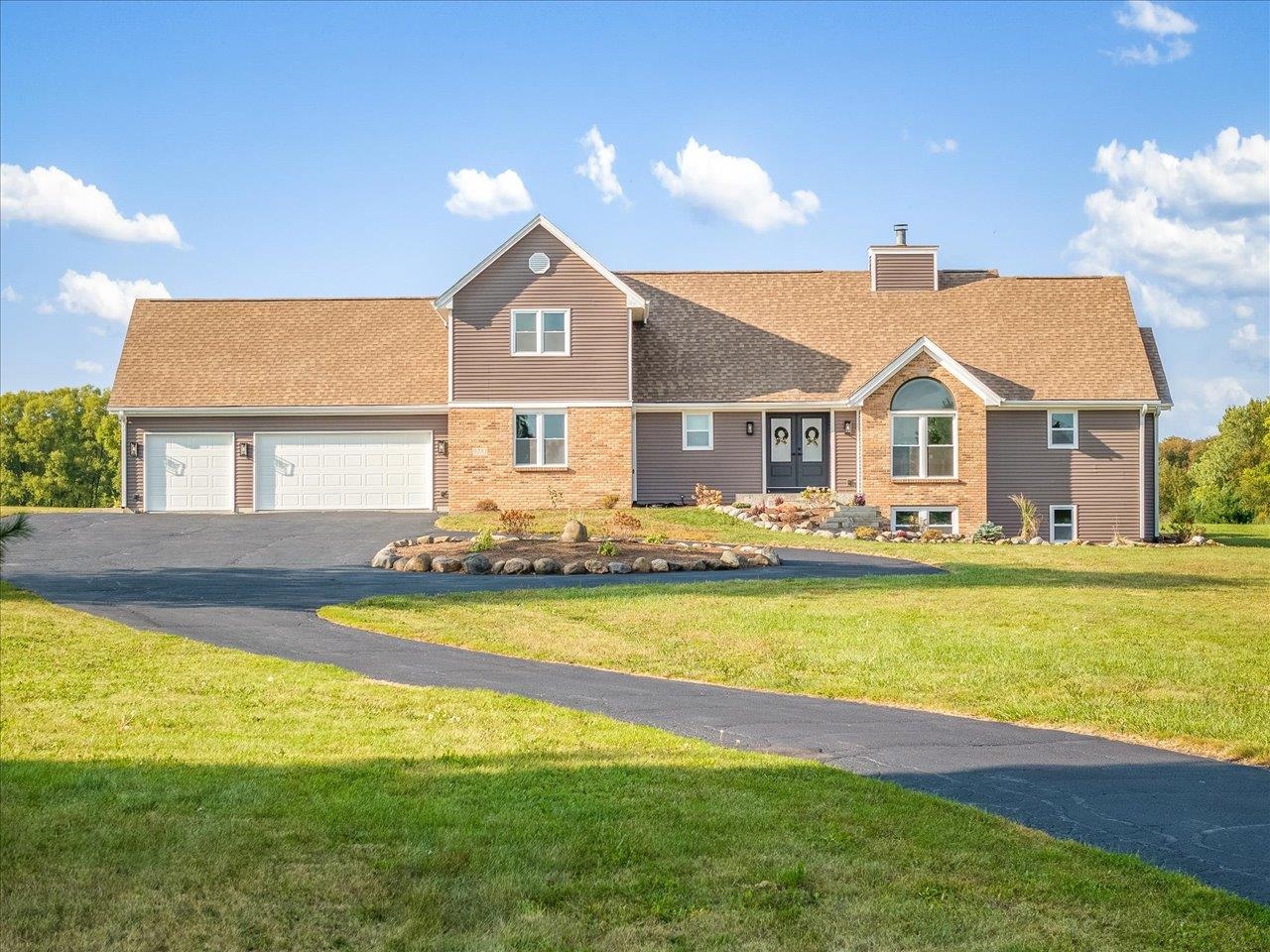 a front view of a house with swimming pool having outdoor seating