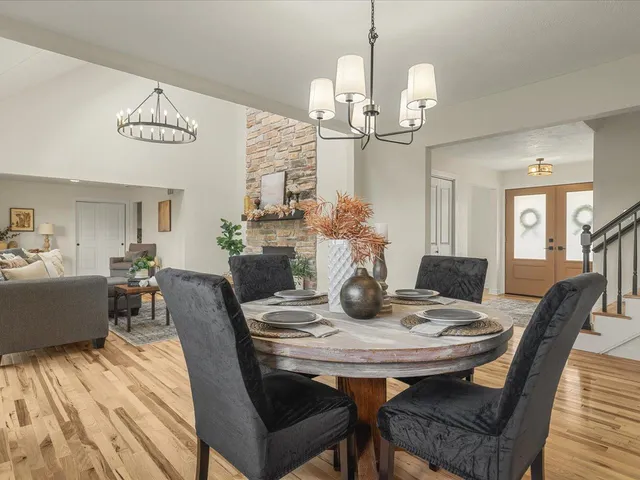 a living room with furniture and a chandelier