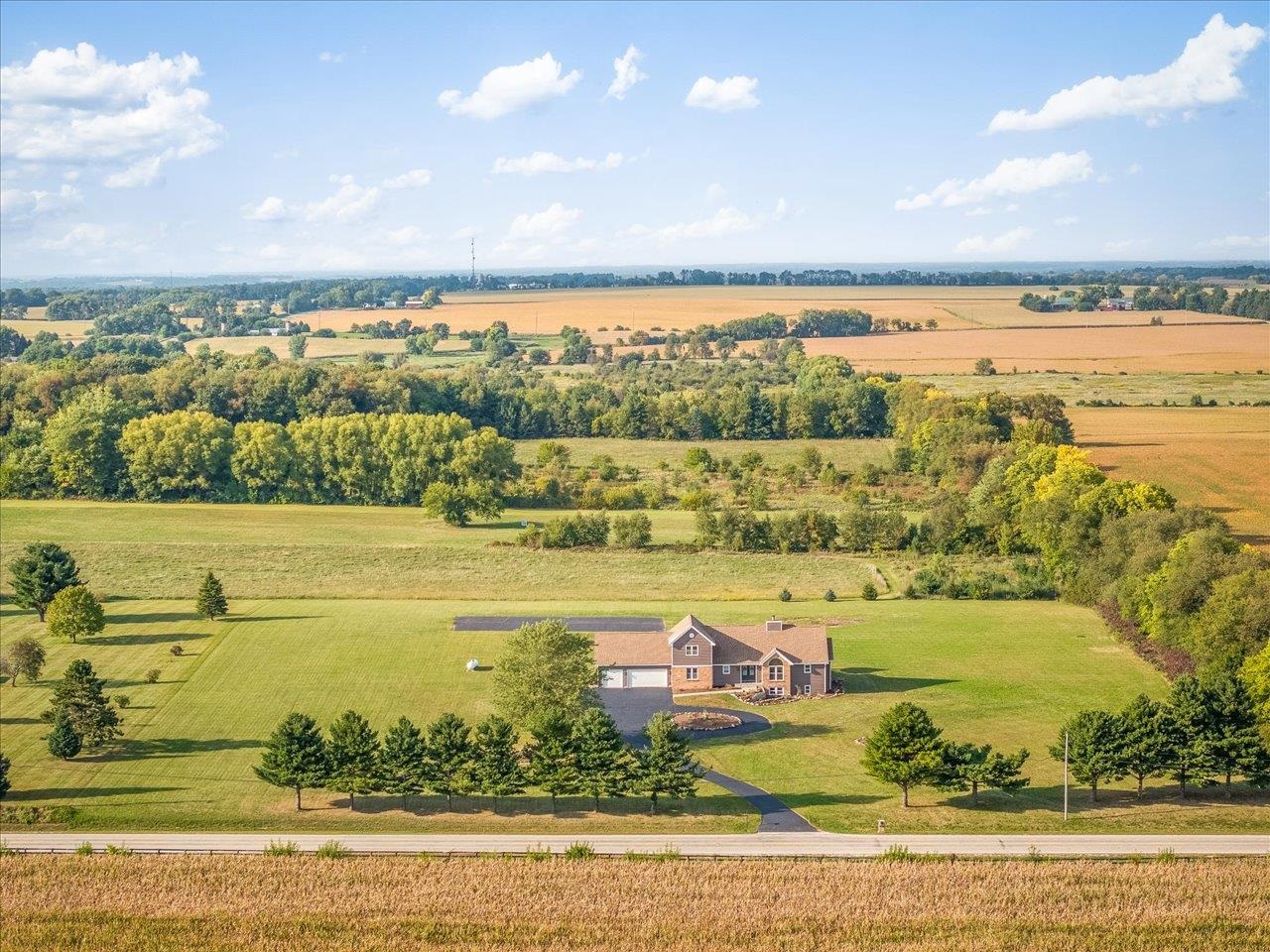 9281 Auburn Road Winnebago, IL 61088 - Photo 2 of 64 a view of a city with an ocean