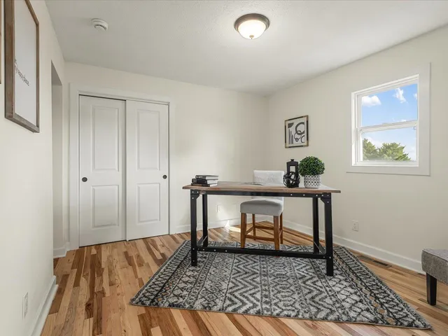 a view of staircase with lots of frames on wall