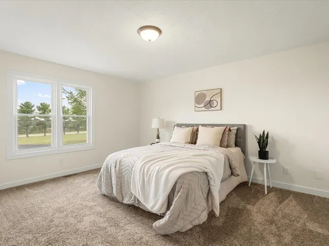 an empty room with an entryway and fire place