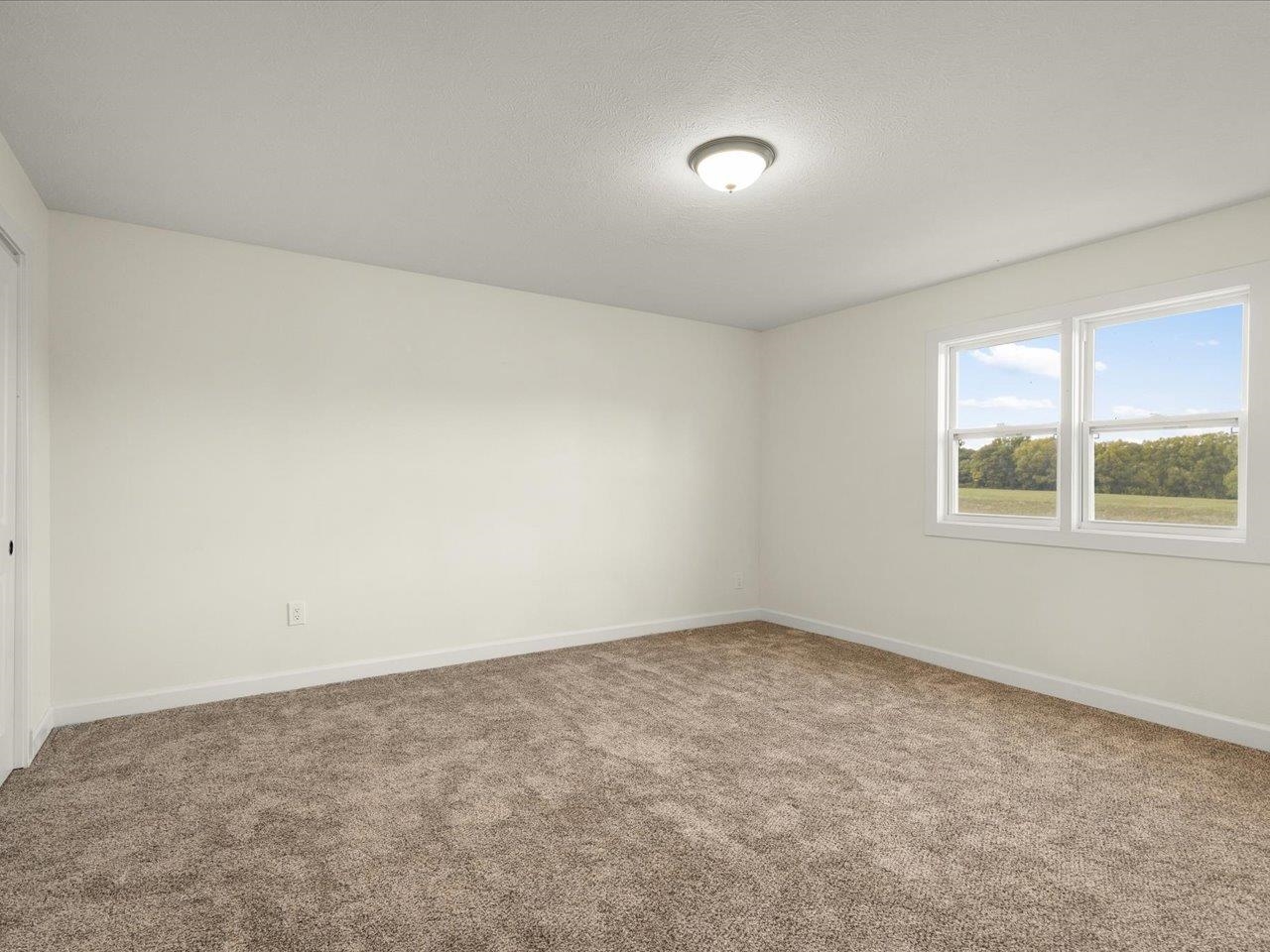 9281 Auburn Road Winnebago, IL 61088 - Photo 44 of 64 an empty room with a window