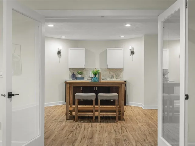 a view of a lake with a yard and a ocean view