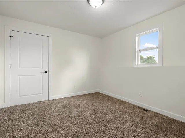 a view of a house with pool and sitting area