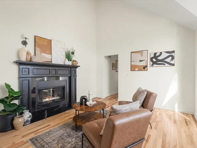 a view of a dining room with furniture wooden floor and chandelier