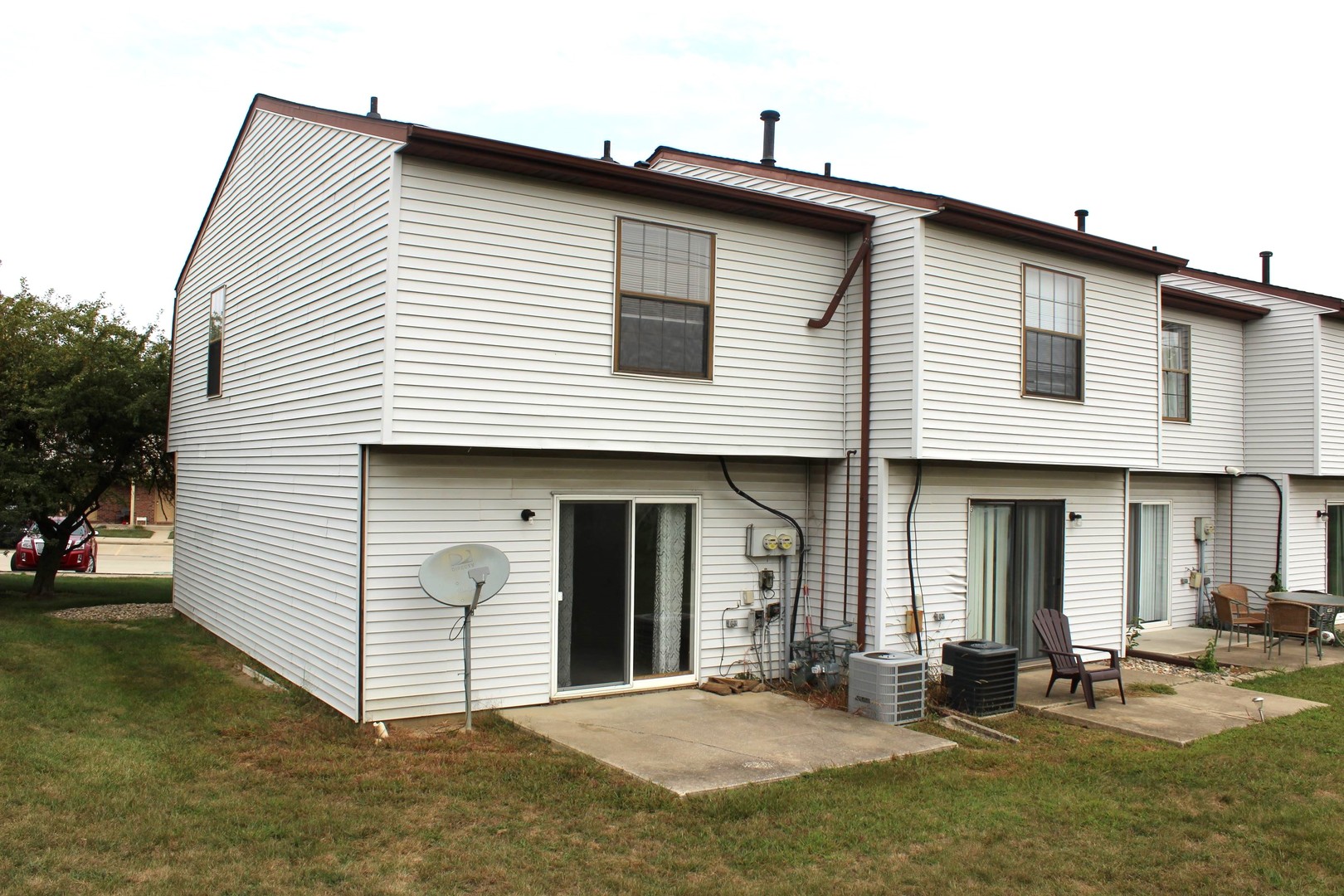 700 North Adelaide Street, Unit 12 Normal, IL 61761 - Photo 15 of 16 a front view of a house with a yard