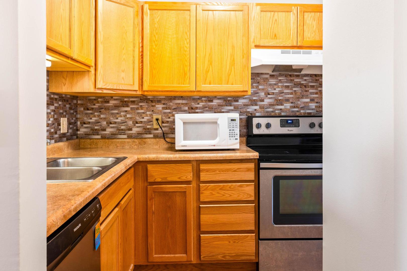 700 North Adelaide Street, Unit 12 Normal, IL 61761 - Photo 4 of 16 a kitchen with a sink and a window