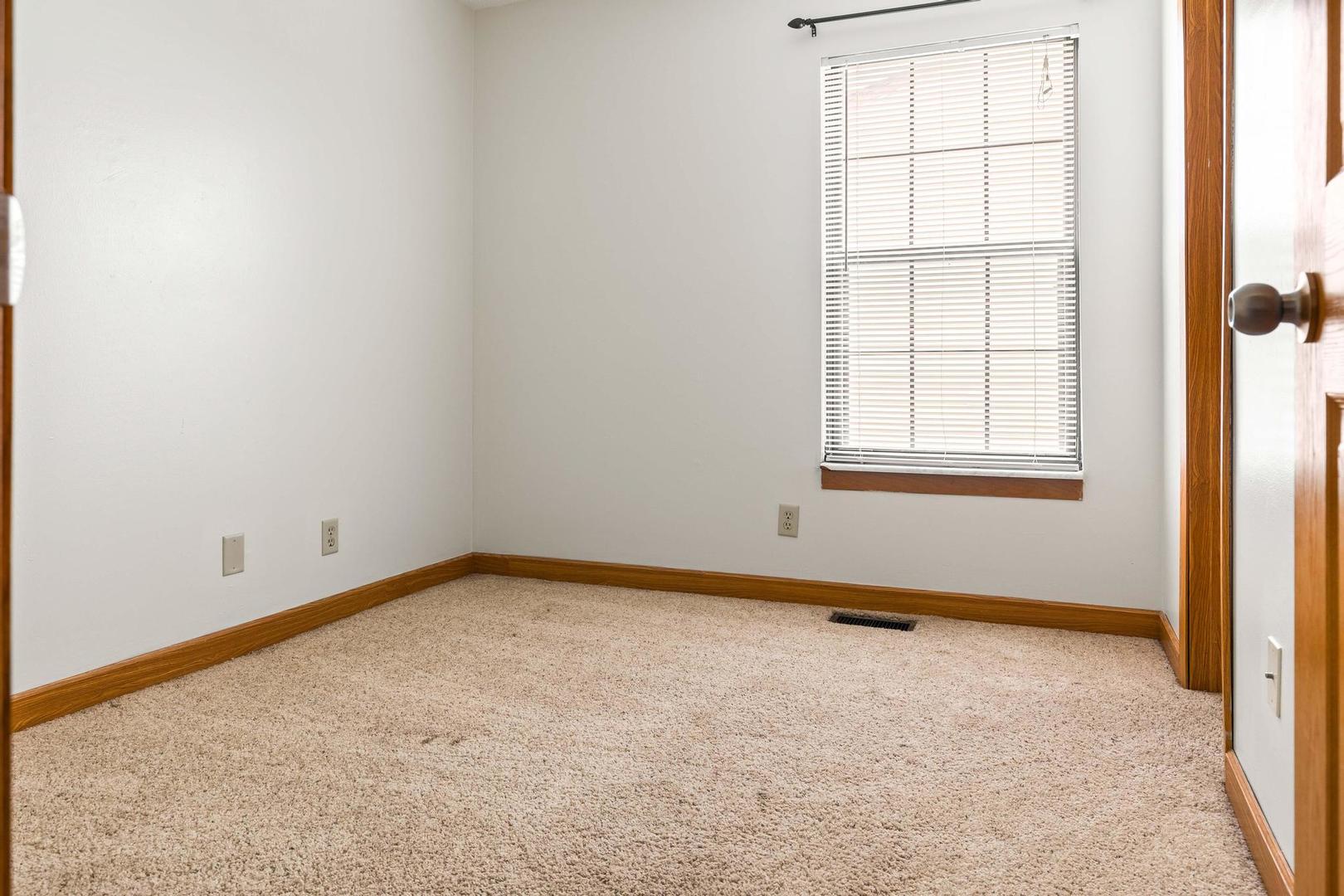 700 North Adelaide Street, Unit 12 Normal, IL 61761 - Photo 8 of 16 an empty room with a window