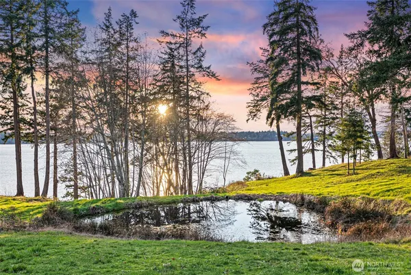a view of a swimming pool with an outdoor space and seating area