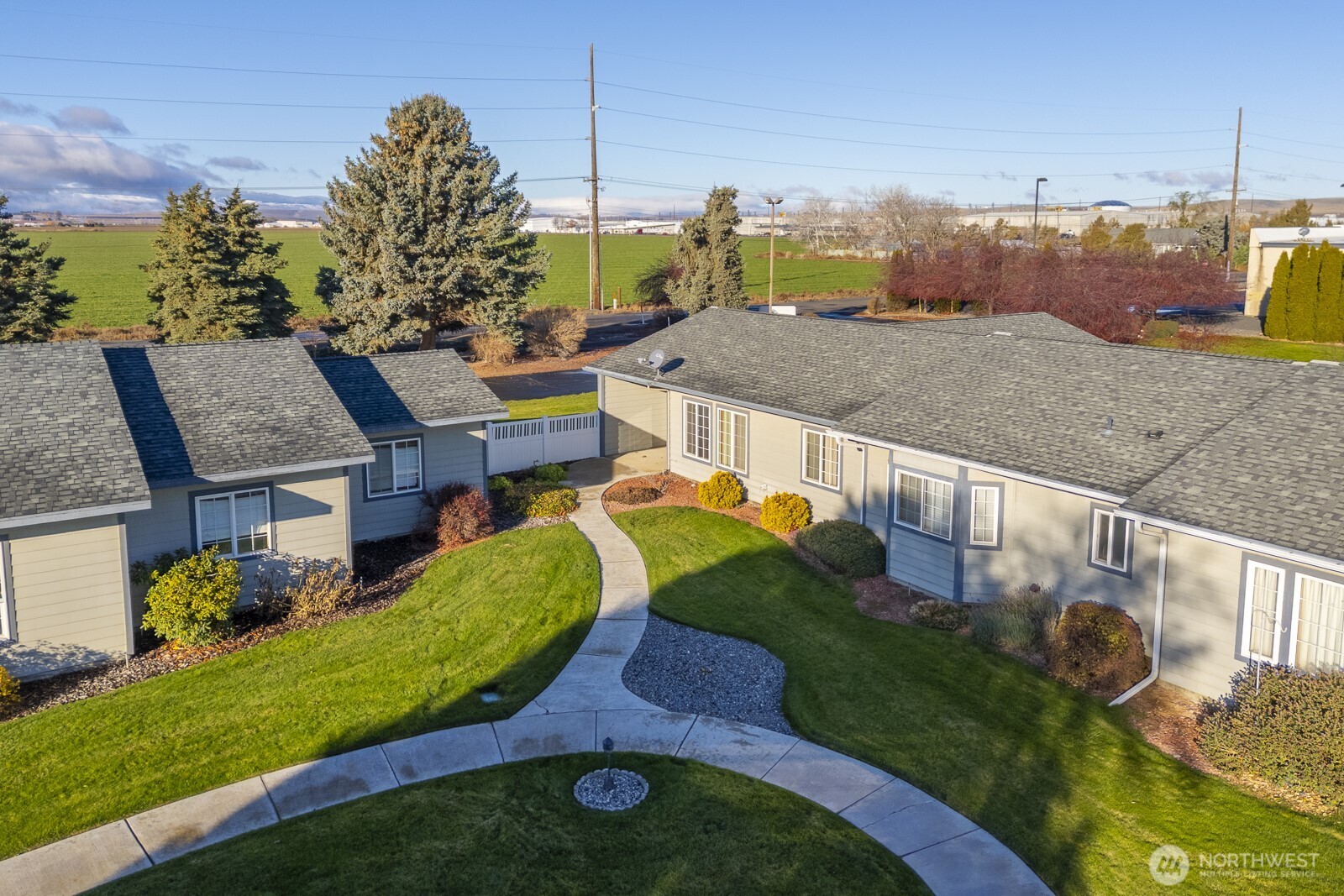 1000 13th Avenue Southwest, Unit 3 Quincy, WA 98848 - Photo 11 of 38 a view of a house with a yard and sitting area