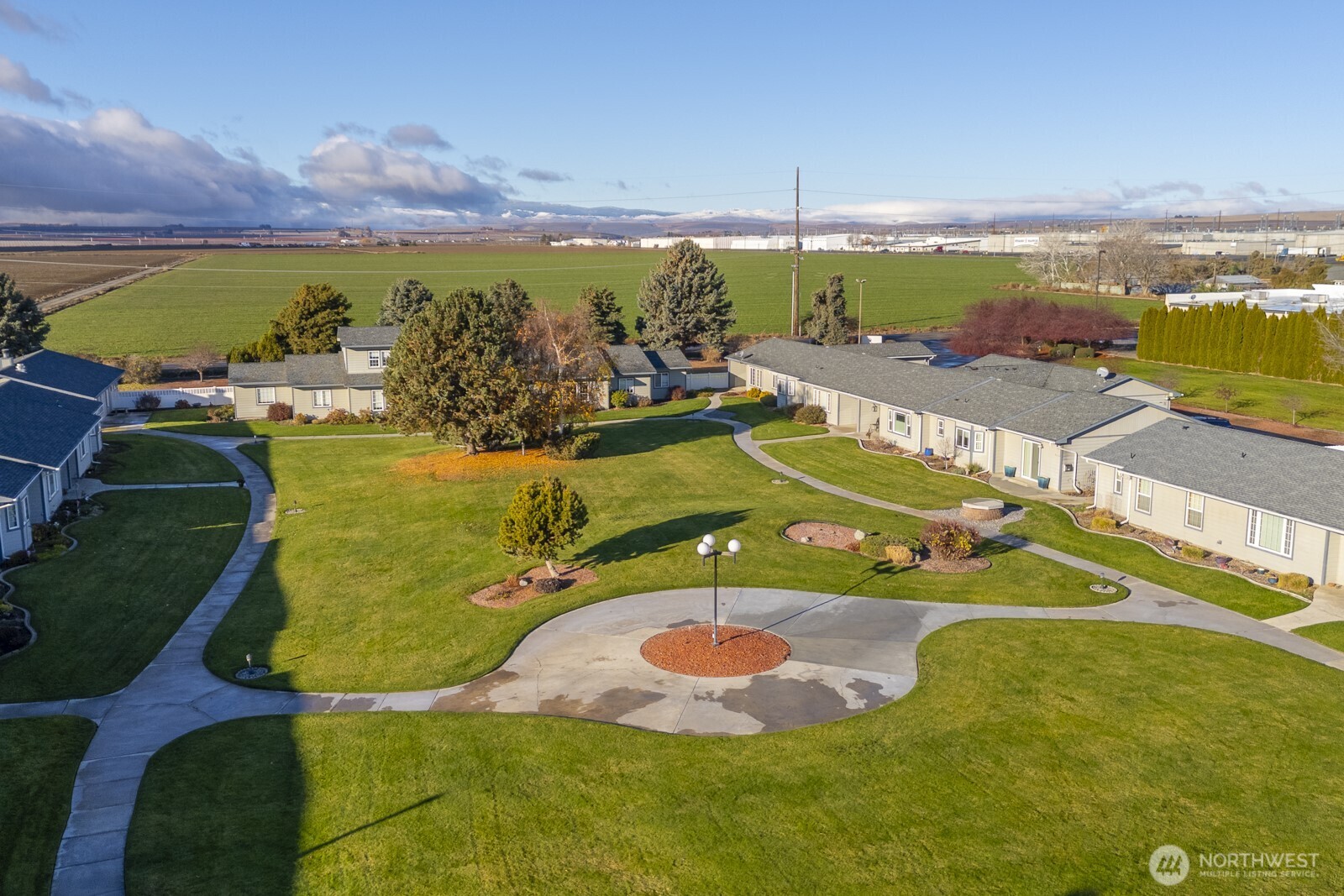 1000 13th Avenue Southwest, Unit 3 Quincy, WA 98848 - Photo 12 of 38 an aerial view of a pool with a yard
