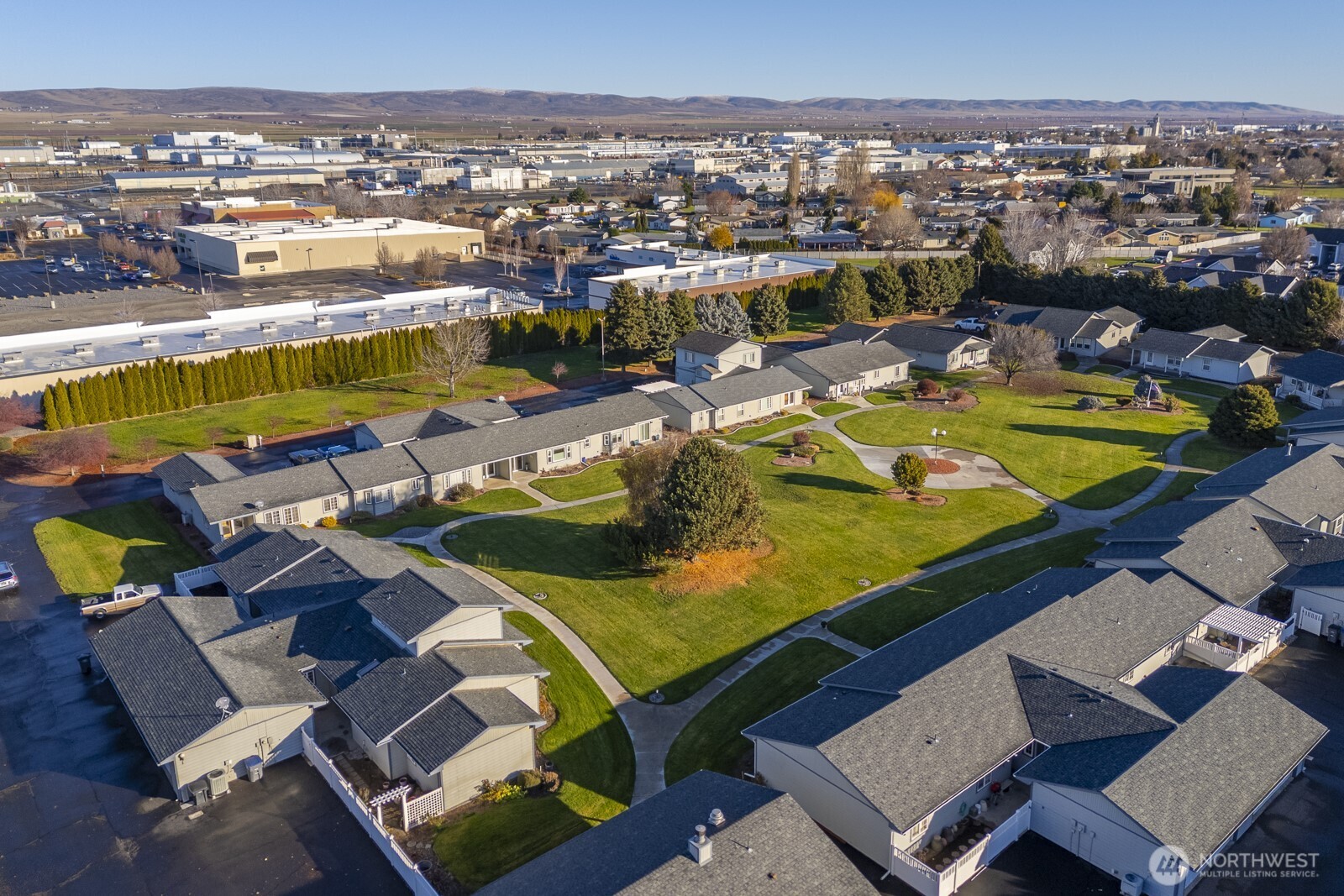 1000 13th Avenue Southwest, Unit 3 Quincy, WA 98848 - Photo 13 of 38 an aerial view of a pool patio swimming pool and ocean view