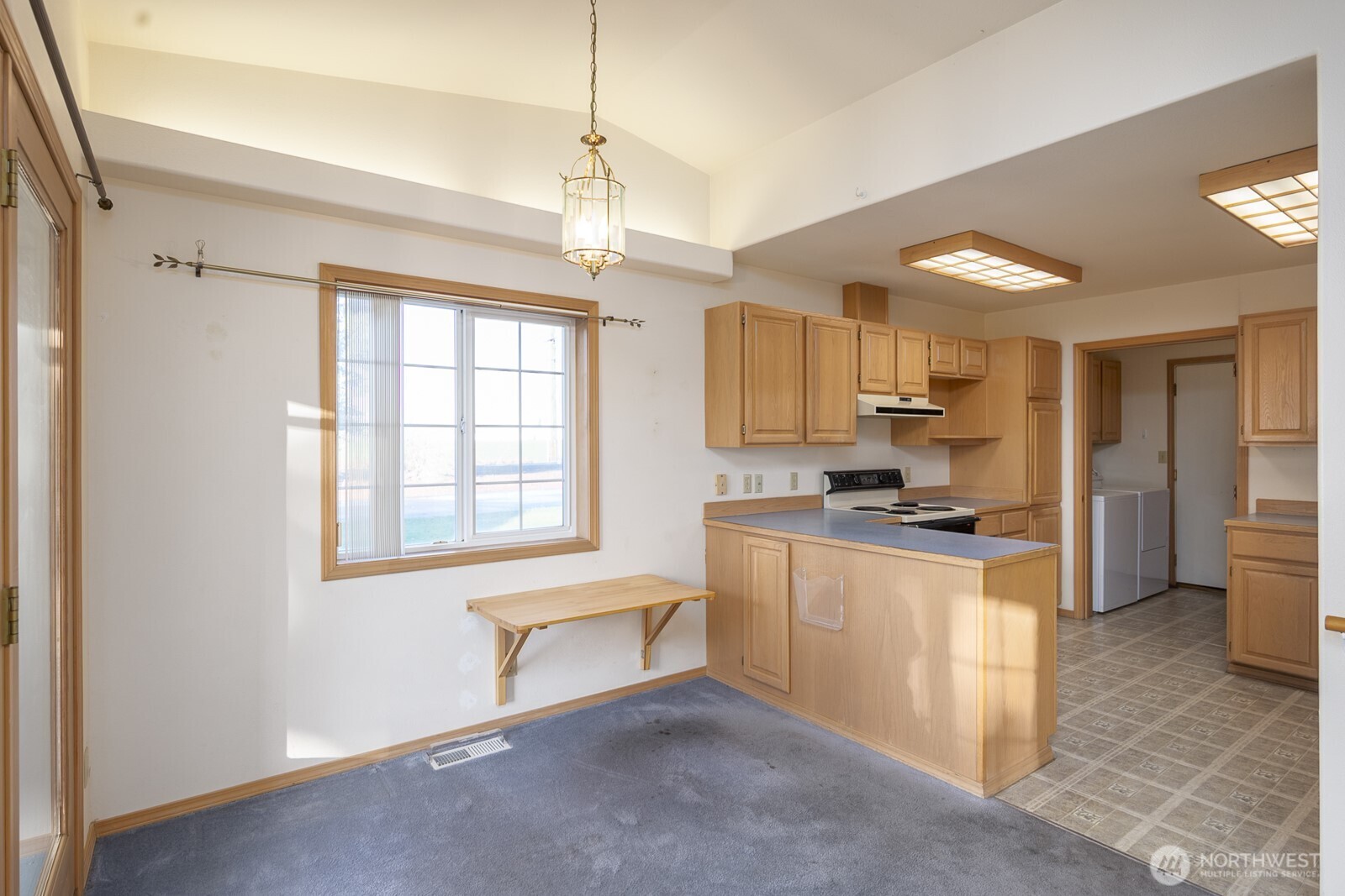 1000 13th Avenue Southwest, Unit 3 Quincy, WA 98848 - Photo 22 of 38 a large kitchen with stainless steel appliances granite countertop a stove and a refrigerator
