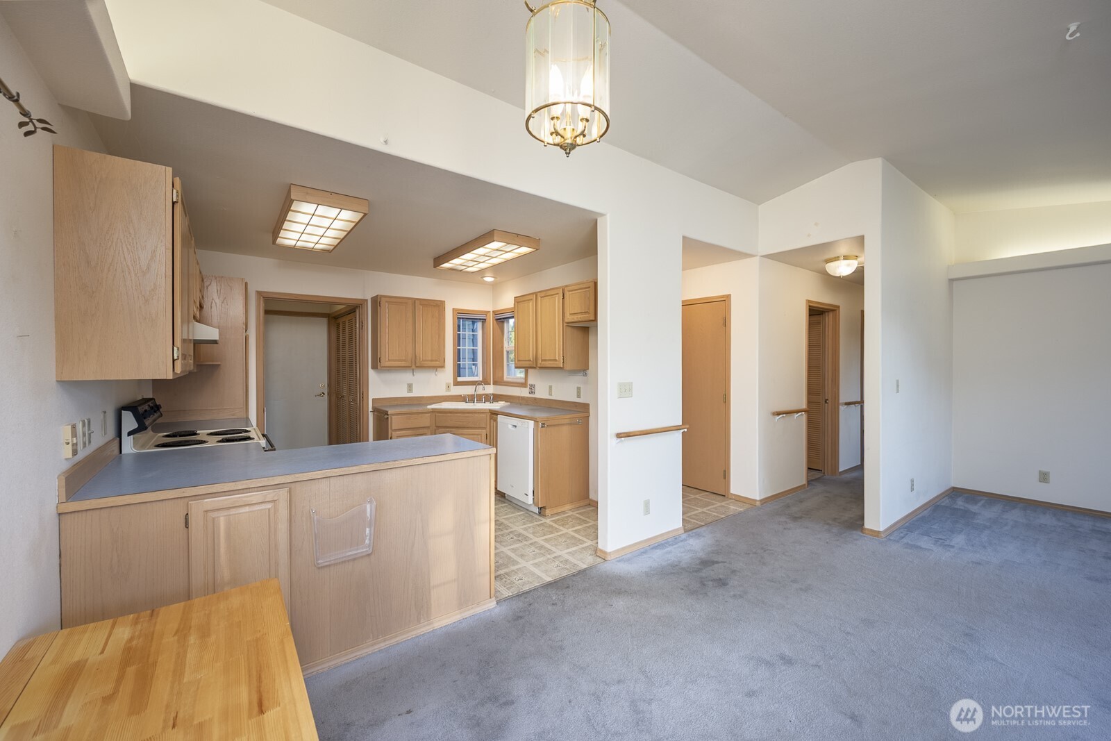 1000 13th Avenue Southwest, Unit 3 Quincy, WA 98848 - Photo 23 of 38 a kitchen with stainless steel appliances granite countertop a sink and cabinets