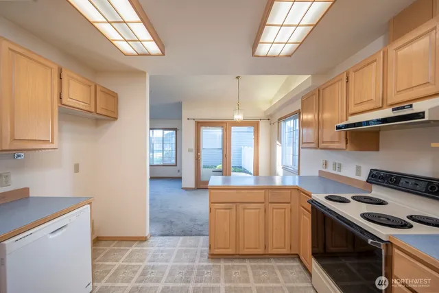 a kitchen that has a sink and a stove