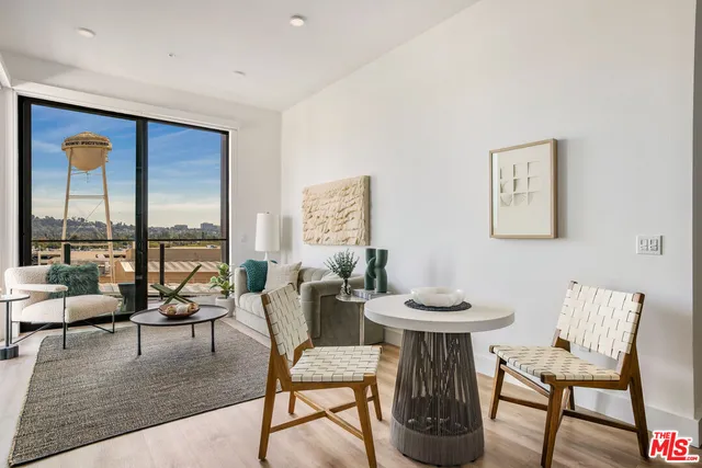 a view of a livingroom with furniture and window