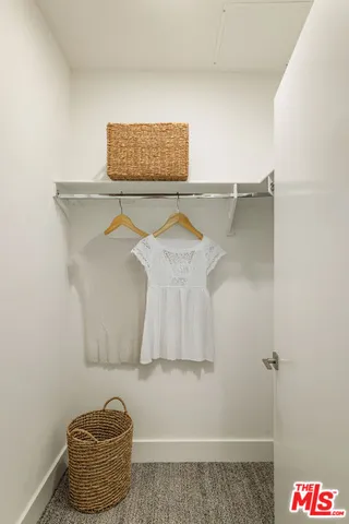 a bathroom with a shower and a window