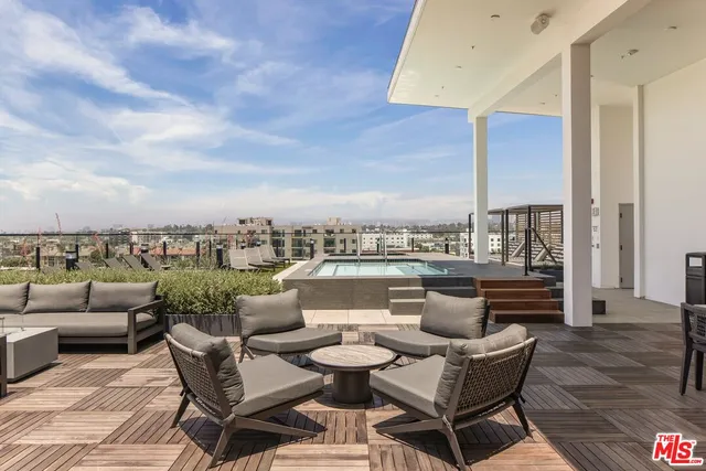 a view of a terrace with couches and potted plants