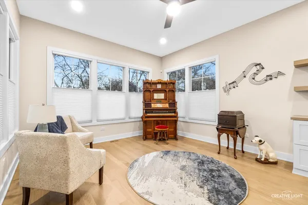 a bedroom with furniture and a flat screen tv
