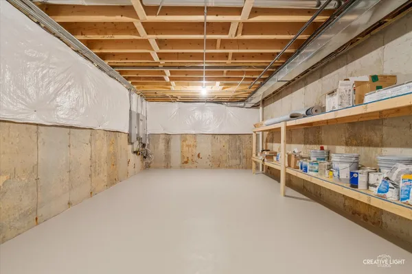 a view of an empty room with storage