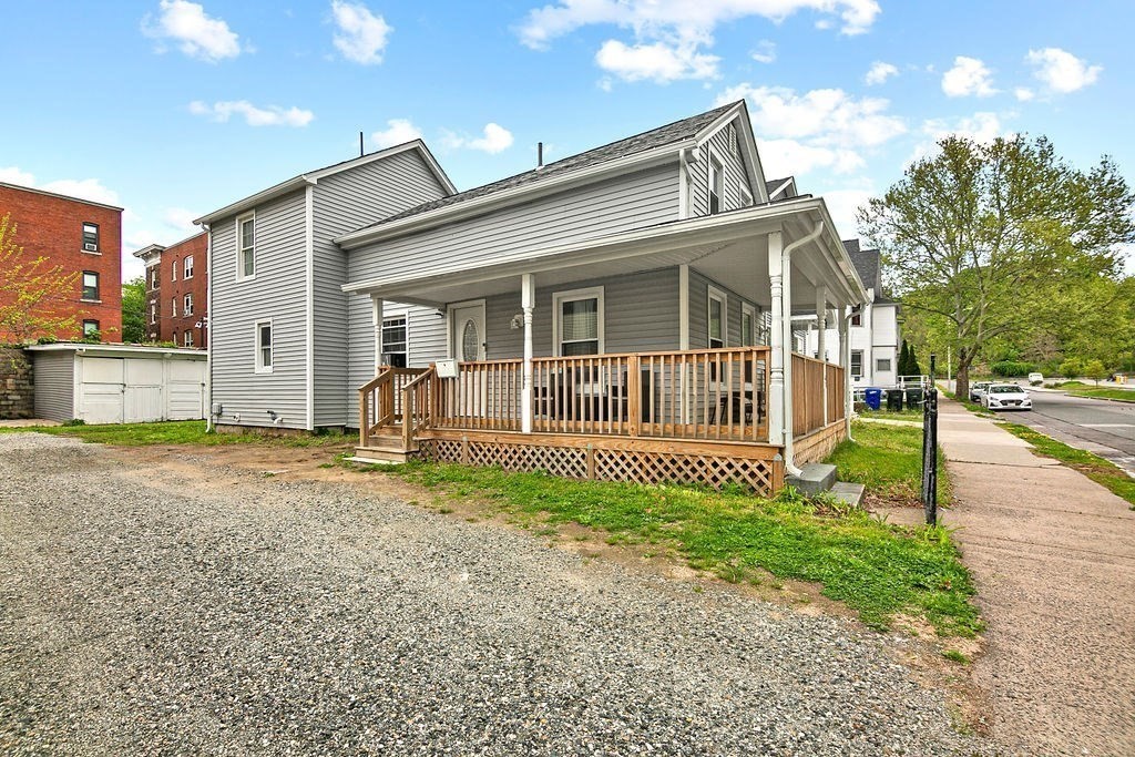 76 Marble Street Springfield, MA 01105 - Photo 2 of 27 a view of a house with a small yard and plants