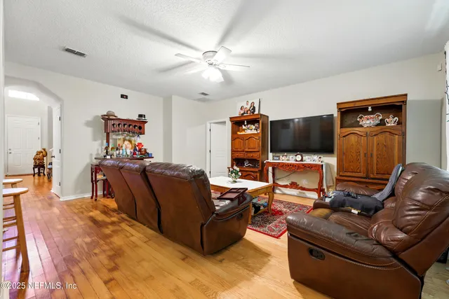 a kitchen with stainless steel appliances granite countertop a refrigerator stove top oven a sink and dishwasher