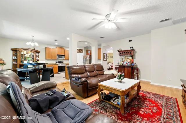 a view of a dining room with furniture and window